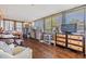 Bright sunroom with wood-look flooring, multiple windows, and ample space for relaxing and entertaining at 37246 Eileen Ave, Zephyrhills, FL 33542