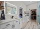 Spacious bathroom featuring double vanity sinks, a walk-in shower, and large closet at 3749 Zachary St, New Port Richey, FL 34655