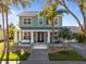Charming two-story home with a cozy front porch, white pillars, and well-manicured lawn at 3749 Zachary St, New Port Richey, FL 34655