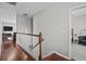 Well-lit hallway with hardwood flooring featuring an open view into the rooms at 3749 Zachary St, New Port Richey, FL 34655