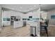 Gourmet kitchen with white cabinetry, granite countertops, stainless steel appliances, and center island at 3749 Zachary St, New Port Richey, FL 34655