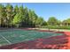 Well-maintained tennis courts surrounded by lush greenery, perfect for recreation and exercise at 3749 Zachary St, New Port Richey, FL 34655