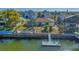 Waterfront home featuring a private boat dock, waterfront access, and tropical landscaping at 4291 Flexer Dr, Hernando Beach, FL 34607