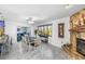 Bright dining area with a table, fireplace, and large windows at 4291 Flexer Dr, Hernando Beach, FL 34607