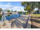 Dock featuring boat lift, waterfront access, and canal views at 4291 Flexer Dr, Hernando Beach, FL 34607