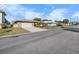 Charming single-story home featuring a stone facade and a well-maintained front yard with mature landscaping at 4291 Flexer Dr, Hernando Beach, FL 34607