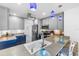 Well-lit kitchen with stainless steel appliances, modern cabinets, and stylish lighting at 4291 Flexer Dr, Hernando Beach, FL 34607