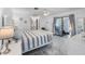 Bright primary bedroom with an en-suite bath and sunroom access at 4291 Flexer Dr, Hernando Beach, FL 34607
