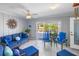 Inviting sunroom with blue furniture and natural light at 4291 Flexer Dr, Hernando Beach, FL 34607