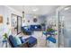 Cozy sunroom with comfortable blue furniture and access to the outdoors at 4291 Flexer Dr, Hernando Beach, FL 34607