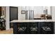 Updated kitchen with stainless steel appliances, white cabinets, and marble countertop bar with chairs at 449 S 12Th St # 1705, Tampa, FL 33602