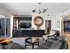 Open living room with built-in entertainment center, comfortable seating, and sliding glass doors to the balcony at 449 S 12Th St # 1705, Tampa, FL 33602