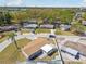 Aerial view showcases a single-story home with a fenced yard, nearby street and surrounding neighborhood at 4733 Bonton Dr, Holiday, FL 34690