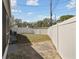 Backyard featuring a patio with brick pavers and vinyl fence at 4733 Bonton Dr, Holiday, FL 34690