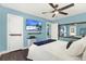Bedroom featuring blue walls, wood floors, and a mounted television at 4831 Fairfield S Ave, St Petersburg, FL 33711