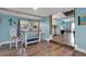Bright dining area with hardwood floors, views to the kitchen, and plenty of natural light at 4831 Fairfield S Ave, St Petersburg, FL 33711