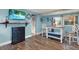 Cozy dining room featuring a dining table and hardwood floors that flows to the living room at 4831 Fairfield S Ave, St Petersburg, FL 33711