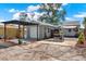Exterior view of home featuring a fenced yard, patio and two-car garage at 4831 Fairfield S Ave, St Petersburg, FL 33711