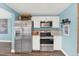 Modern kitchen featuring stainless steel appliances, white cabinets, and an open design for easy entertaining at 4831 Fairfield S Ave, St Petersburg, FL 33711