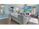 Bright living room featuring hardwood floors, a cozy fireplace, and an open layout that seamlessly connects to the kitchen at 4831 Fairfield S Ave, St Petersburg, FL 33711