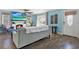 Bright living room featuring hardwood floors, a cozy fireplace, and a gray sofa at 4831 Fairfield S Ave, St Petersburg, FL 33711
