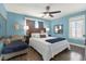 Inviting main bedroom with hardwood floors, large windows, and relaxing decor at 4831 Fairfield S Ave, St Petersburg, FL 33711