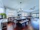 Open concept dining area featuring a modern table, stylish furnishings, and lots of natural light at 513 Hammock Pine Blvd, Clearwater, FL 33761