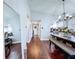 Hallway view of the dining room with a view of the front entry door at 513 Hammock Pine Blvd, Clearwater, FL 33761
