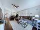 Open floor plan living room with a view of the dining room and kitchen at 513 Hammock Pine Blvd, Clearwater, FL 33761