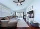 Bright living room features hardwood floors and a sliding door to the screened in patio at 513 Hammock Pine Blvd, Clearwater, FL 33761