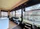 Bright sunroom with plenty of natural light, surrounded by lots of plants and many windows at 513 Hammock Pine Blvd, Clearwater, FL 33761