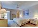 Inviting bedroom featuring soft lighting, neutral decor, painting, and ceiling fan to create a relaxing retreat at 5521 80Th N St # 315, St Petersburg, FL 33709
