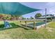Outdoor bocce ball court with a manicured lawn and shaded seating area, perfect for leisurely afternoons at 5521 80Th N St # 315, St Petersburg, FL 33709