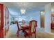 Dining room with hardwood table set and an elegant chandelier at 5521 80Th N St # 315, St Petersburg, FL 33709