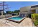 Relaxing community hot tub with seating and a privacy fence at 5521 80Th N St # 315, St Petersburg, FL 33709