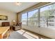 Inviting and airy living space featuring large windows offering serene views, creating a tranquil ambiance at 5521 80Th N St # 315, St Petersburg, FL 33709