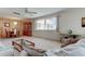 Bright living room features neutral carpet, dining area, large windows and ceiling fan for a comfortable and inviting space at 5521 80Th N St # 315, St Petersburg, FL 33709