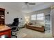 Inviting office with a cozy couch, bright window, and ample shelving at 5521 80Th N St # 315, St Petersburg, FL 33709