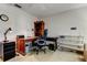 Comfortable office space with hardwood desk, shelving, and a black executive chair at 5521 80Th N St # 315, St Petersburg, FL 33709
