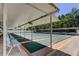 Outdoor shuffleboard courts featuring covered seating areas and a well-maintained playing surface for recreational enjoyment at 5521 80Th N St # 315, St Petersburg, FL 33709