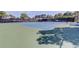 Well-maintained tennis courts with new nets surrounded by lush greenery, offering a perfect space for sports and recreation at 5521 80Th N St # 315, St Petersburg, FL 33709
