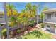 A lovely exterior view featuring an apartment building and numerous palm trees at 5912 5Th N Ave # 8, St Petersburg, FL 33710