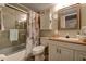 Well-maintained bathroom featuring a shower, bathtub, vanity with sink, and mirrored medicine cabinet at 5920 80Th N St # 107, St Petersburg, FL 33709