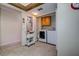 Functional laundry room area with tiled floors and modern washer and dryer at 5920 80Th N St # 107, St Petersburg, FL 33709