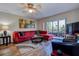 Cozy living room showcasing a plush sectional sofa, stylish decor, and sliding glass doors at 5920 80Th N St # 107, St Petersburg, FL 33709