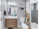 Stylish bathroom featuring modern vanity, mirror, and shower-tub combination at 6902 El Centro Ct, Tampa, FL 33634