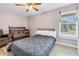 Bedroom with a crib and bed with lots of sunlight from window at 6902 El Centro Ct, Tampa, FL 33634