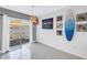 View of the modern dining room with glass doors to the outside at 6902 El Centro Ct, Tampa, FL 33634