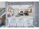Well-equipped kitchen featuring a breakfast bar with pendant lighting and stainless steel appliances at 6902 El Centro Ct, Tampa, FL 33634