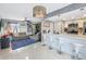 Bright kitchen with an open layout, stylish island, and seamless connection to the living area at 6902 El Centro Ct, Tampa, FL 33634